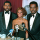 Willis Edwards, president of the Beverly Hills/Hollywood NAACP; Dionne Warwick; and Luther Vandross on Dec. 14, 1986, in Los Angeles (Alison Wise/AP Images)